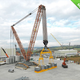 Illustration for article titled World's Strongest Crawler Crane Can Raise the Roof—off a Stadium